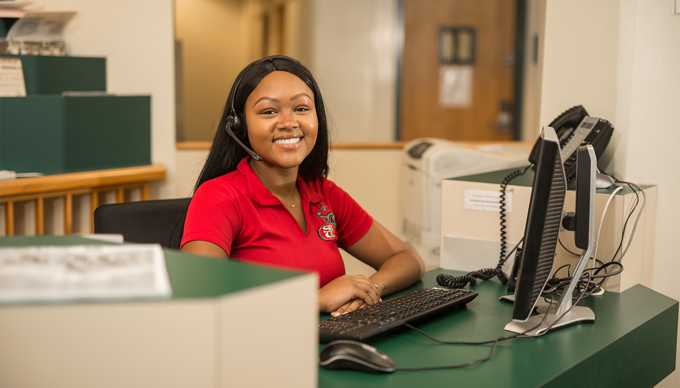 Student worker at the welcome desk